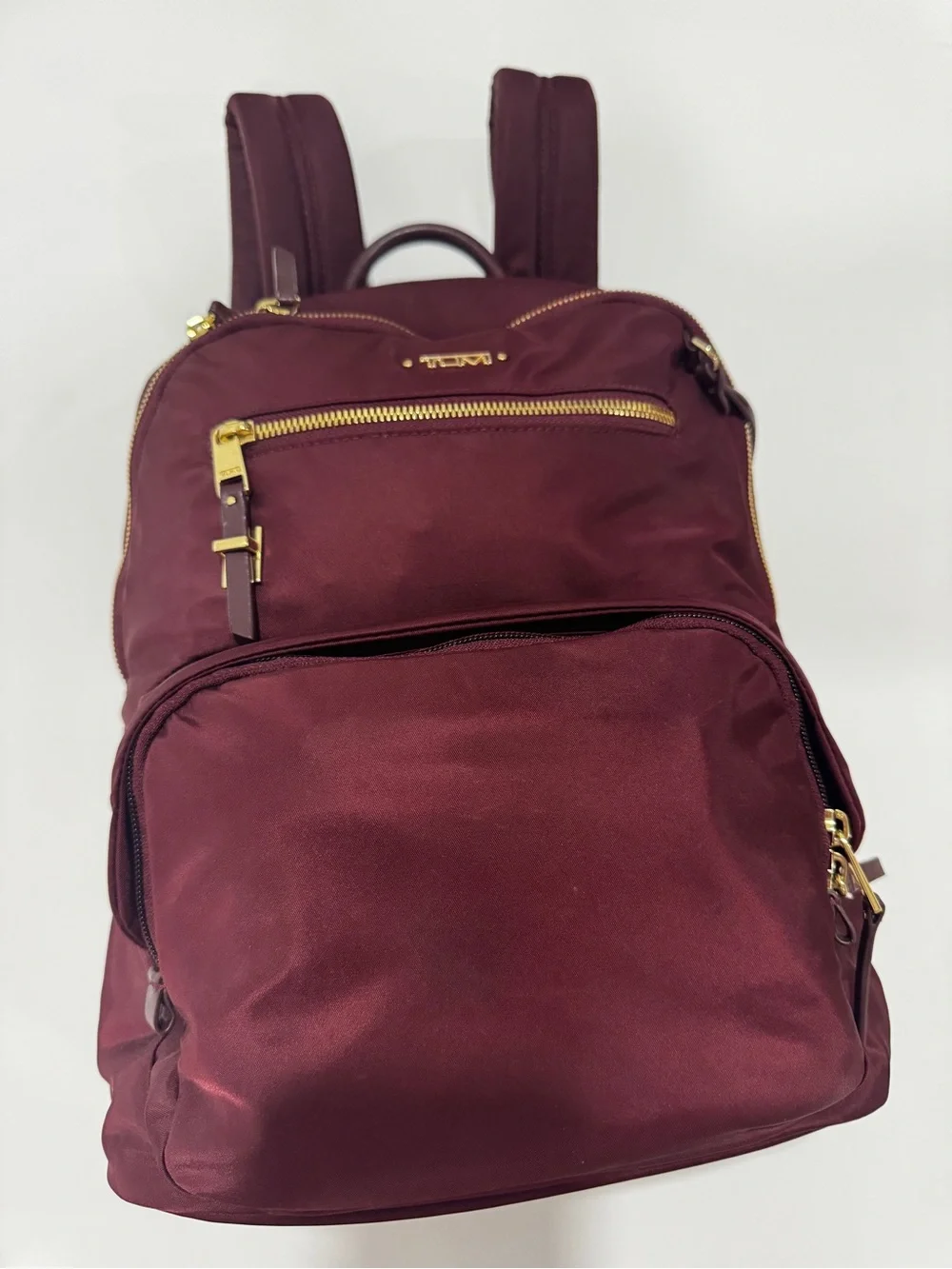 TUMI Unisex Voyageur Hilden Beetroot color Backpack with Gold Hardware